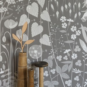 Hedgerow wallpaper in 'pipit' by Hannah Nunn, a warm brown botanical wall covering with a wild tangle of plants and flowers
