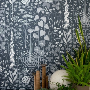Hedgerow wallpaper in 'nocturne' by Hannah Nunn, a deep, dark blue botanical wall covering with a wild tangle of plants and flowers image 1