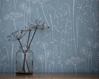 Paper Meadow wallpaper in 'teal' by Hannah Nunn, a blue floral botanical wall covering with meadow seed heads and grasses