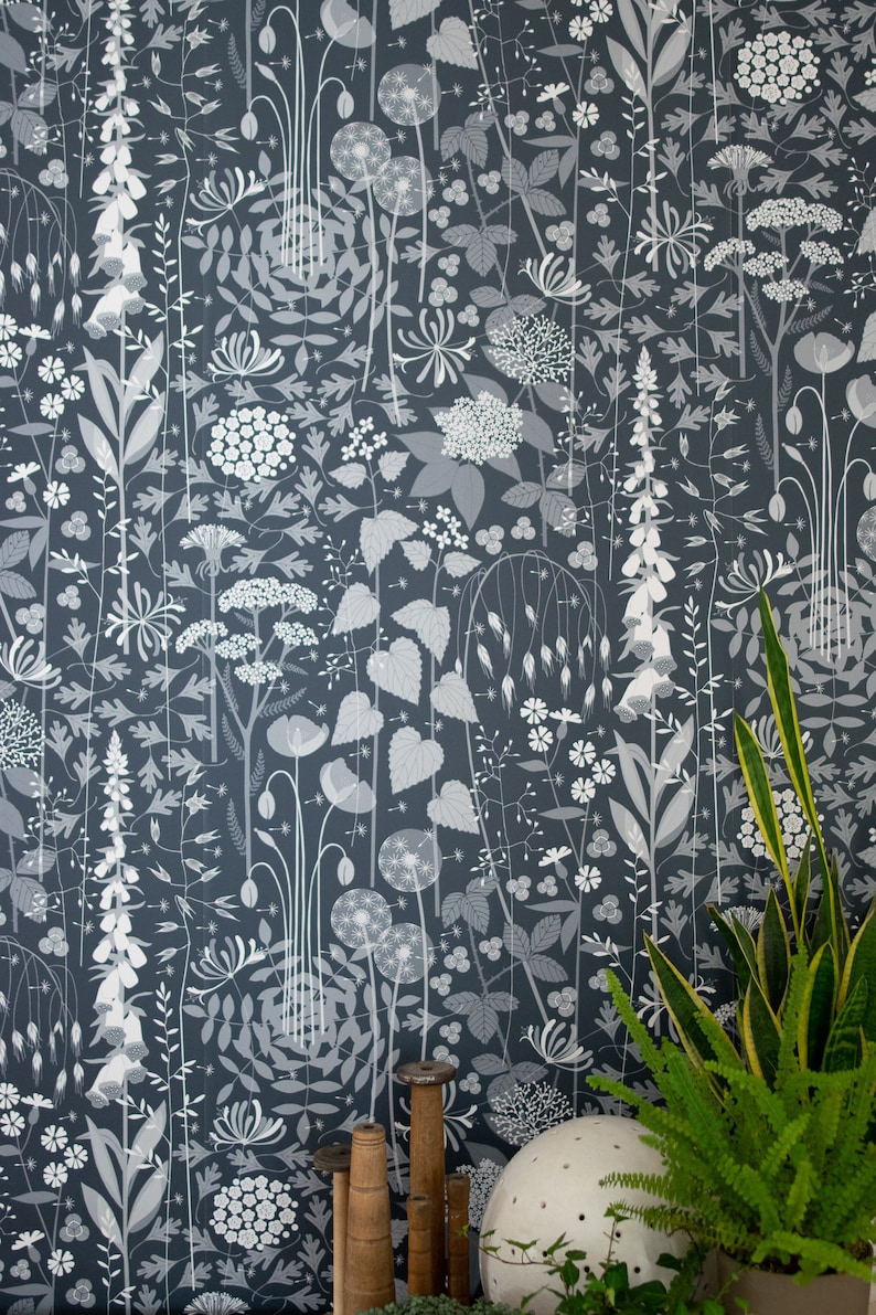 Hedgerow wallpaper in 'nocturne' by Hannah Nunn, a deep, dark blue botanical wall covering with a wild tangle of plants and flowers image 1