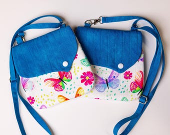 Bolso mariposa con correa ajustable