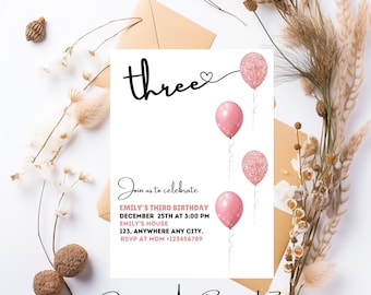 May include: Pink birthday invitation with the word "three" in black script with a heart and balloons. The text reads "Join us to celebrate Emily's Third Birthday December 25th at 3:00 PM Emily's House 123, Anywhere Any City. RSVP at Mom +123456789"