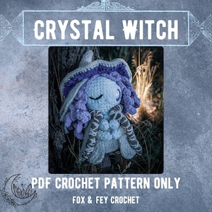 May include: A crocheted witch doll with a white body, purple hair, and a matching hat. The doll has a scarf with a brown and white pattern. The image includes the text "CRYSTAL WITCH" and "PDF CROCHET PATTERN ONLY".