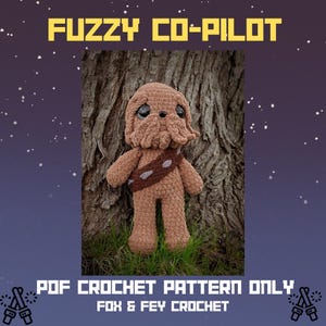 May include: A crocheted brown plush toy resembling a character from a science fiction film, with a bandolier and a textured head. The text "FUZZY CO-PILOT" is at the top, and "PDF CROCHET PATTERN ONLY" and "FOX & FEY CROCHET" are at the bottom.