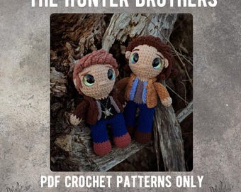 May include: Two crocheted figures of the Hunter brothers from the TV show Supernatural. The figures are brown, blue, and beige. The figures are sitting on a tree branch. The text "THE HUNTER BROTHERS" is at the top of the image. The text "PDF CROCHET PATTERNS ONLY" is at the bottom of the image. The text "FOX & FEY CROCHET" is below the text "PDF CROCHET PATTERNS ONLY".