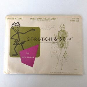May include: A vintage sewing pattern envelope for a shawl collar jacket. The pattern is for sizes 28-30-32-34-36-38-40 and is designed by Ann Person. The envelope features a cartoon illustration of a stick figure wearing a tutu and the text "S-T-R-E-T-C-H & SEW".