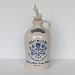 May include: A set of three ceramic mugs with a speckled, matte finish. The mugs are in shades of cream, light gray, and dark gray. Each mug has a simple, minimalist design, perfect for coffee or tea.