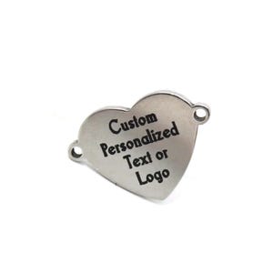 May include: A silver heart-shaped charm with the text "Custom Personalized Text or Logo" engraved on its surface. The charm has two small holes for attaching to a necklace or bracelet.