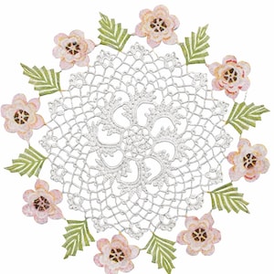 May include: A white, crocheted doily with a floral design. The doily is surrounded by pink flowers with brown centers and green leaves. The flowers and leaves are arranged around the edge of the doily.