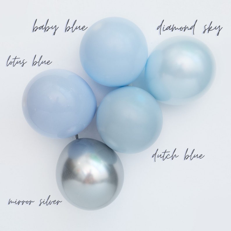 May include: Five balloons in various shades of blue, including baby blue, lotus blue, diamond sky, and dutch blue. One balloon is a metallic silver color. The balloons are arranged in a circle on a white background.