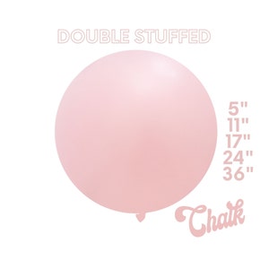 May include: A light pink balloon with the text "DOUBLE STUFFED" above it and "Chalk" below it. The balloon is inflated to a large size and has a smooth, glossy finish. The text "5", "11", "17", "24", and "36" are listed to the right of the balloon, with an inch symbol after each number.