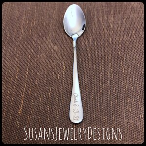 May include: A silver spoon with the text "Clark 8-13-21" engraved on the handle.