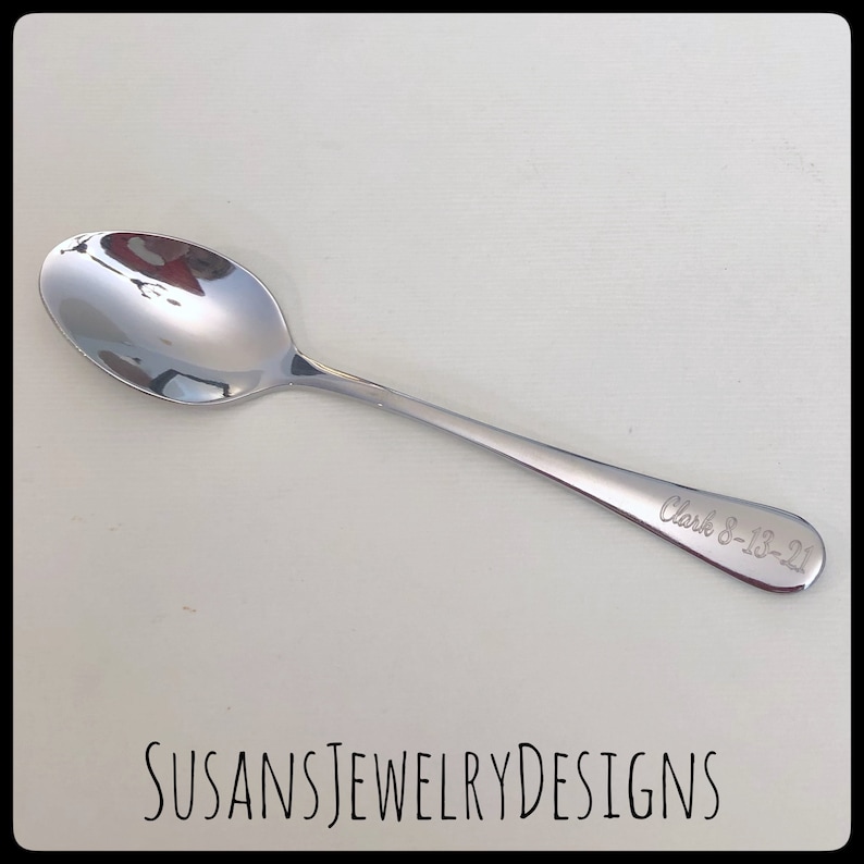 May include: A silver spoon with the inscription "Clark 8-13-21" engraved on the handle.