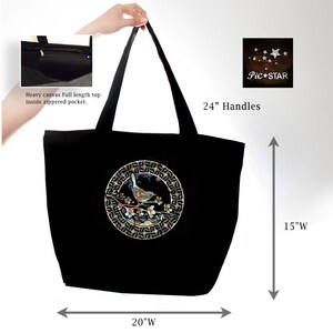 May include: Black canvas tote bag with a 24-inch handle and a circular design featuring a bird on a branch with flowers. The bag is 20 inches wide and 15 inches tall.