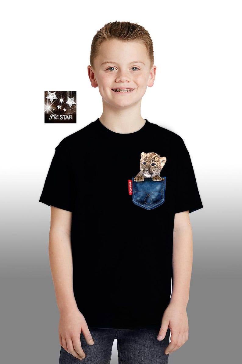 May include: A black t-shirt with a blue pocket featuring a small leopard cub peeking out. The t-shirt has short sleeves and a crew neck.