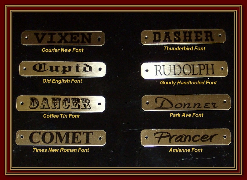 May include: Eight gold metal name tags with black engraved text. The name tags are arranged in two rows of four. The names on the tags are Vixen, Cupid, Dancer, Comet, Dasher, Rudolph, Donner, and Prancer. The font used for each name is listed below the tag. The background is black.