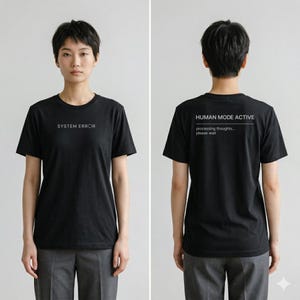 May include: Black crew neck t-shirt with white text that reads "SYSTEM ERROR" on the front. The back of the shirt has the text "HUMAN MODE ACTIVE" and "processing thoughts... please wait".