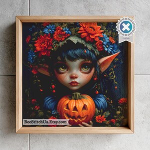 May include: A square framed wall art piece featuring a digital illustration of a dark-haired elf with large eyes and pointed ears, surrounded by red and blue flowers, holding a carved orange jack-o'-lantern pumpkin with a spooky face.