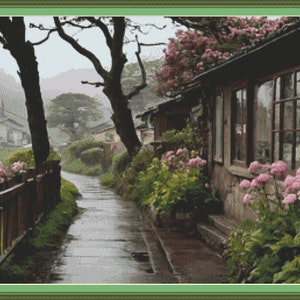 May include: A narrow, cobbled path winds through a Japanese village, lined with traditional houses and lush greenery. Pink flowers bloom along the path, adding a touch of colour to the scene. The houses have wooden beams and tiled roofs, and the windows are framed with dark wood.