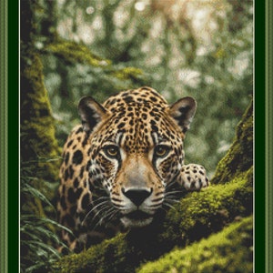 May include: A jaguar with a spotted coat peeks out from behind a mossy tree trunk in a lush green jungle. The sun shines through the leaves, creating a dappled light effect.