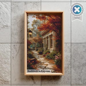 May include: A framed rectangular wall art piece featuring a printed scene of a stone pathway leading toward a building with columns, surrounded by autumn trees with orange foliage and a black street lamp. The text BeeStitchUa.Etsy.com is visible.