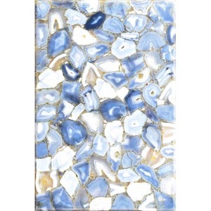 May include: Rectangular surface composed of irregularly shaped blue, white, and tan agate stones. The stones are tightly fitted together, creating a mosaic-like pattern. The edges of the stones are outlined with a gold-colored material.