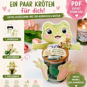 Könnte beinhalten: Ein digitales Bastelprojekt mit einer Frosch-Illustration im Aquarellstil und dem Text "Ein paar Kröten für dich!" auf einem Schild. Der Frosch ist zum Ausschneiden gedacht und wird an einem Glas mit Holzdeckel befestigt, um Geld zu halten.