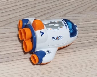 Spaceship and astronaut with momentum activated wheels.