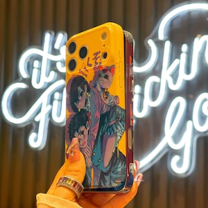 May include: Yellow and blue phone case featuring an anime-style illustration. The case has a glossy finish and a design with multiple characters and a cat. The case has a yellow top with camera cutouts.