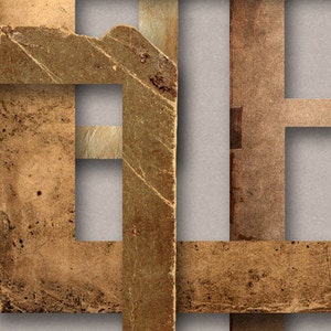 May include: A close-up of a textured, brown paper frame with a grid pattern. The frame is made of multiple pieces of paper that have been layered and overlapped. The paper has a worn and aged look, with visible creases and tears.