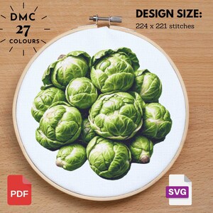 May include: A cross-stitch embroidery hoop featuring a detailed depiction of several green Brussels sprouts. The design size is 224 x 221 stitches and uses 27 colors. Includes PDF and SVG file icons.