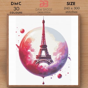 May include: A cross stitch pattern of the Eiffel Tower in a pink and purple watercolor bubble. The pattern is 240 x 300 stitches and uses 30 DMC colors.