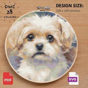 May include: A cross-stitch pattern of a fluffy dog's face, framed in a wooden hoop. The design uses 28 colors and measures 129 x 135 stitches. Includes PDF and SVG file formats.