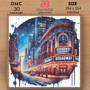 May include: Cross-stitch design depicting a night scene on Broadway. The image shows illuminated theatre signs, city buildings, and a starry sky. The design includes the text "Broadway Theaters" and "Broadway". The pattern size is 254 x 254 stitches.
