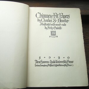 May include: The title page of the book Chimney-Pot Papers by Charles S. Brooks, illustrated with wood-cuts by Fritz Endell. The text includes the date 1920, New Haven: Yale University Press, and London: Humphrey Milford: Oxford University Press.