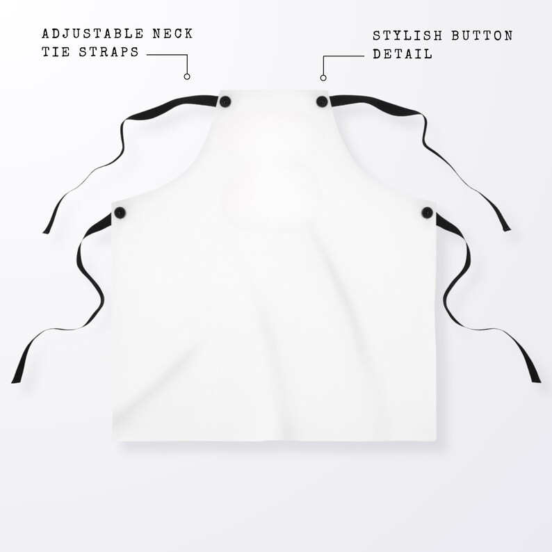 May include: White apron with adjustable neck tie straps and a stylish button detail.