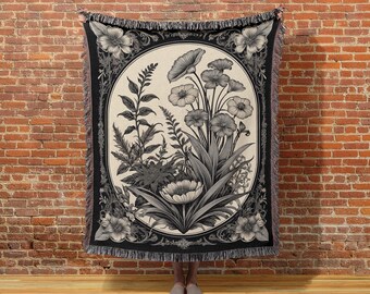 Manta tejida con flores: tapiz de algodón blanco y negro