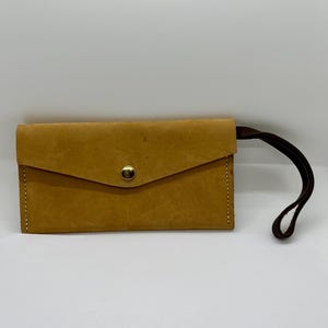 Monedero vintage de ante y cuero con correa de muñeca