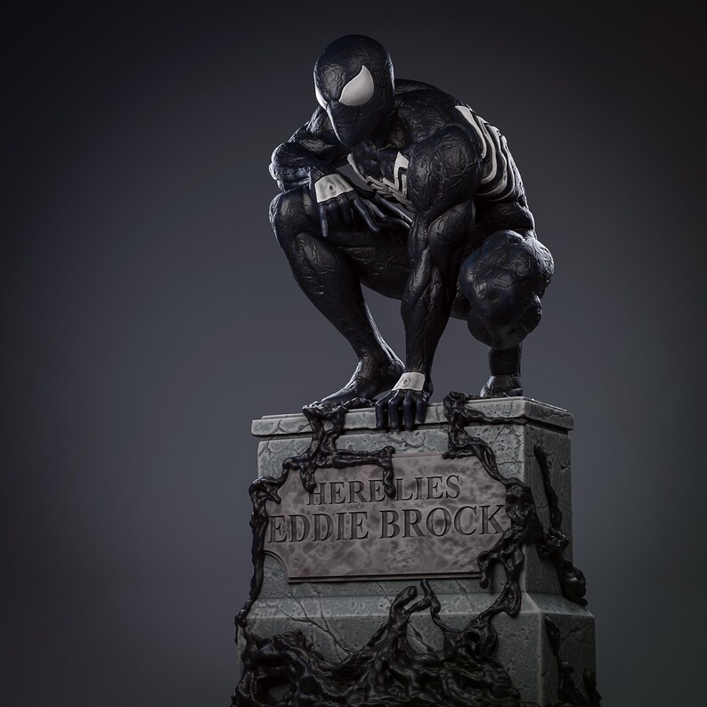 May include: A black and white statue of a superhero in a crouching position atop a stone monument. The monument reads "HERE LIES EDDIE BROCK" in white lettering. The statue has white accents and a spider-like design.