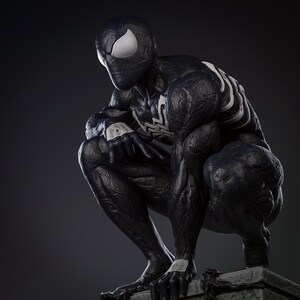 May include: A black and white Spider-Man statue in a crouching pose. The figure has a textured, muscular appearance with white spider symbols and eye shapes. The statue is set against a dark grey background.