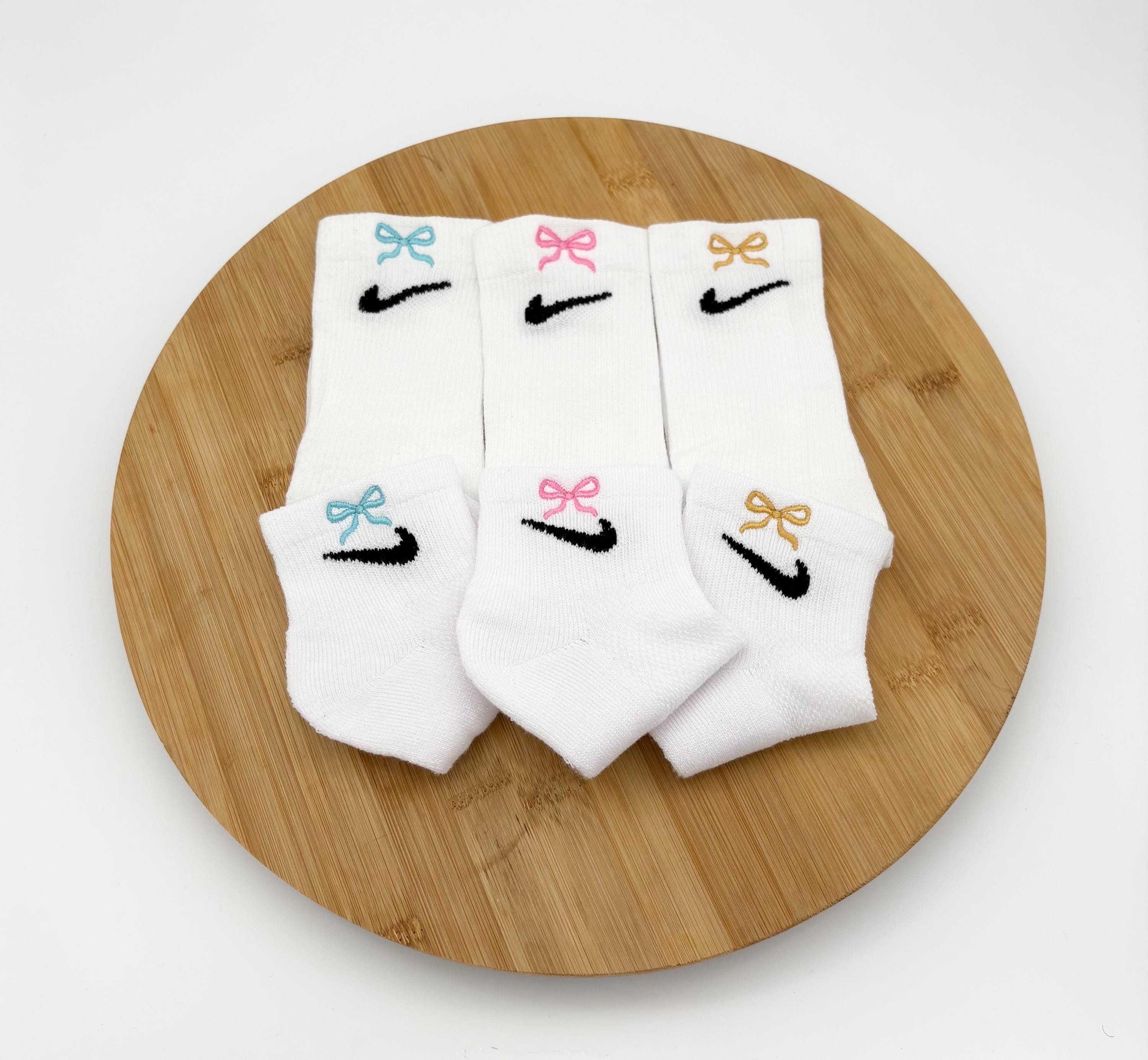 white nike socks with navy swoosh