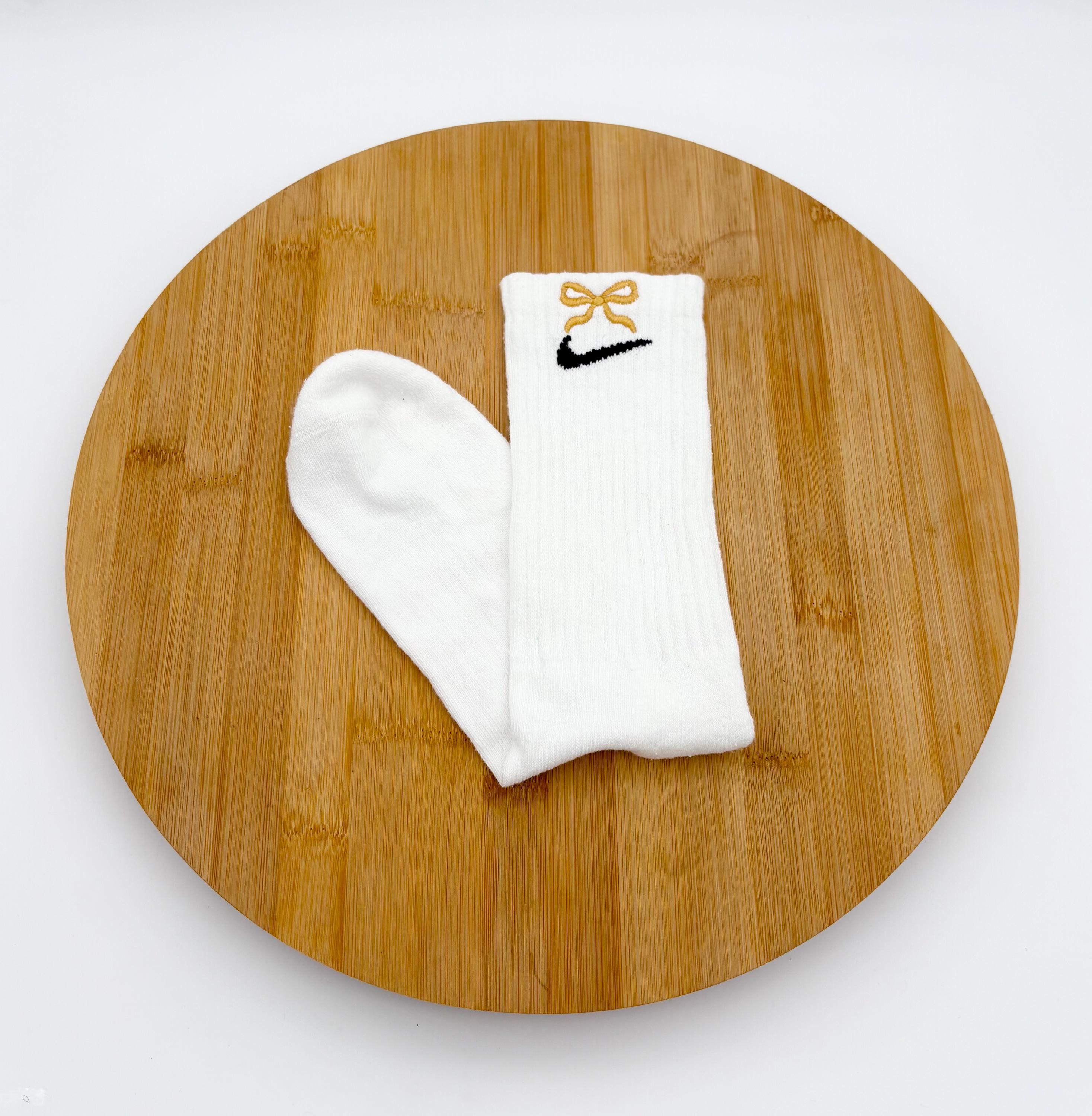 white nike socks with orange swoosh