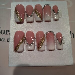 Medium square French tip press ons with ombre, gold flakes, and rhinestones