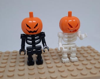 Par de minifiguras de esqueleto de calabaza