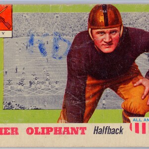 May include: A vintage football trading card featuring Elmer Oliphant, a halfback for the Army team. The card has a red and white striped border and the text "ALL AMERICAN" at the bottom.