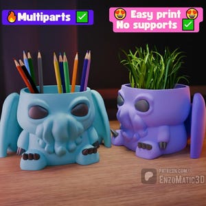 May include: Two 3D-printed Cthulhu-themed containers. One is light blue and holds colored pencils. The other is purple and contains green plants. The containers have large eyes, tentacles, and wing-like features. Text on the image says "Multipart" and "Easy print No supports".