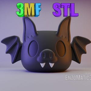 Può includere: Una statuetta di pipistrello nera stampata in 3D con occhi grandi e zanne. La statuetta è etichettata "3MF STL" in testo colorato.
