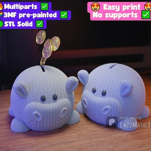 May include: Two light blue piggy banks shaped like hippos, with coins dropping into one. The banks have a textured knit pattern and simple facial features. Text in the image indicates they are easy to print and pre-painted.