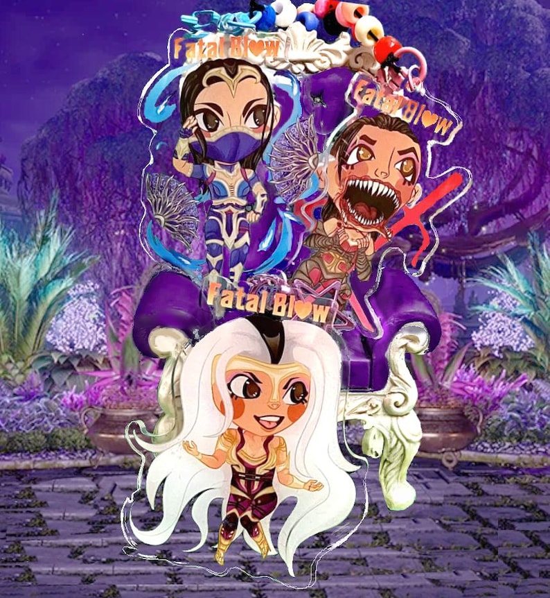 May include: Three colorful acrylic charms featuring anime-style characters with the text "Fatal Blow" on each charm. The characters are wearing colorful outfits and have large eyes. The charms are hanging from a purple throne.