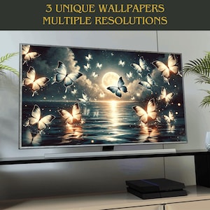 May include: A digital display screen showing a dark blue and black background with a full moon and many white butterflies flying over a body of water. The text "3 UNIQUE WALLPAPERS MULTIPLE RESOLUTIONS" is displayed at the top of the screen.